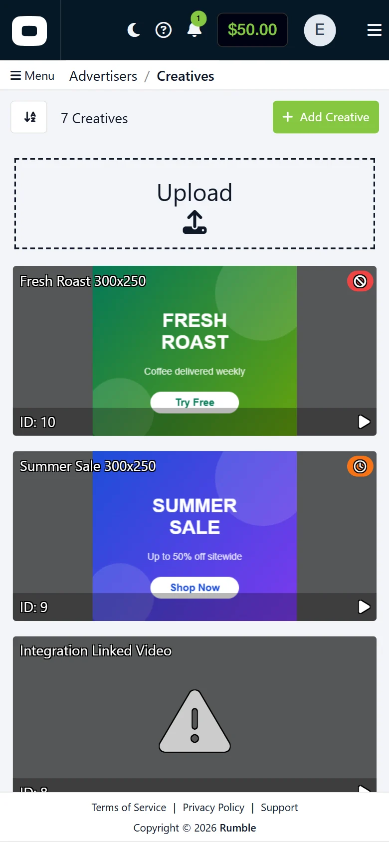 Redesigned creatives library on a phone: upload area and creative cards.